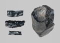 Group of 3 worked obsidian fragments and a raw obsidian lump