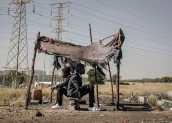 african american successful men came back in poor village