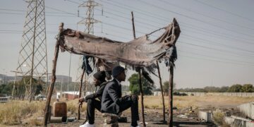 african american successful men came back in poor village