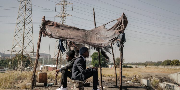 african american successful men came back in poor village